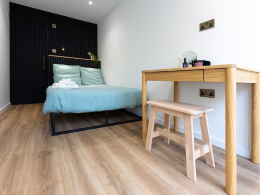 Interior of the Coorie Plus with Bed and Desk